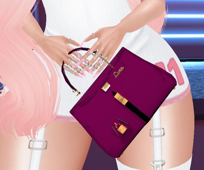 Custom bag with a gold name tag, held by an IMVU avatar